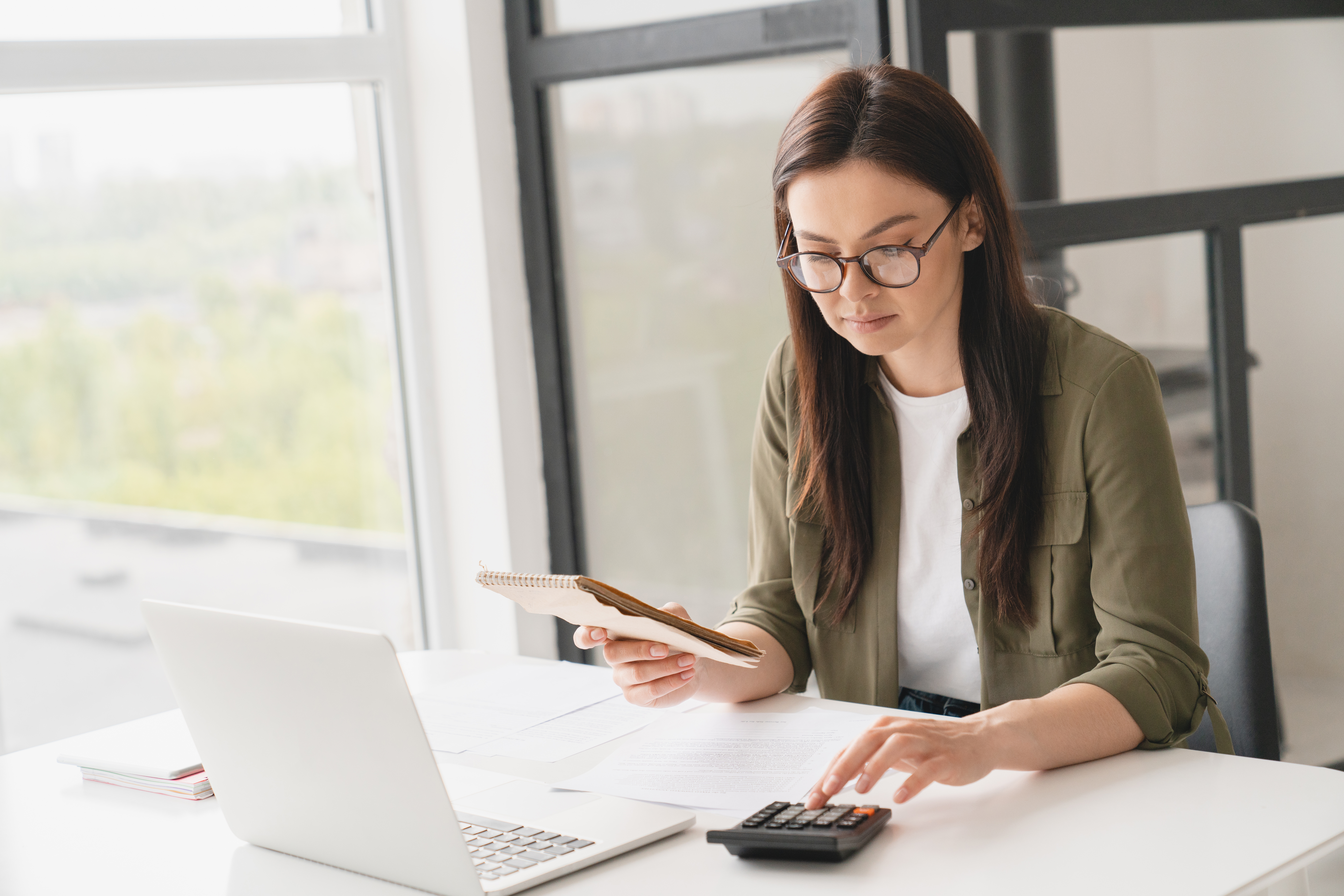 business woman counting funds planning budget paying bills