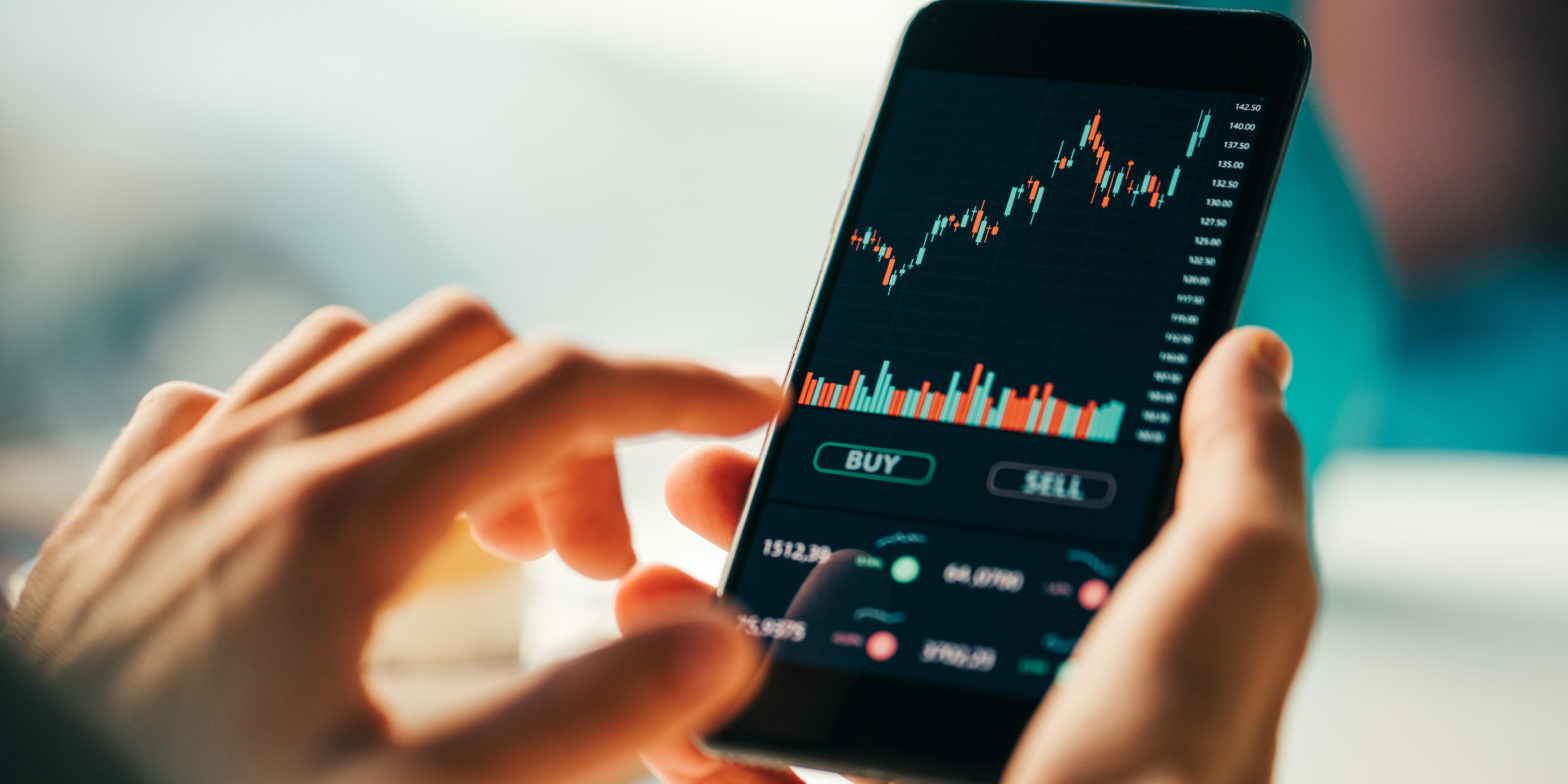 woman touching mobile phone investment app