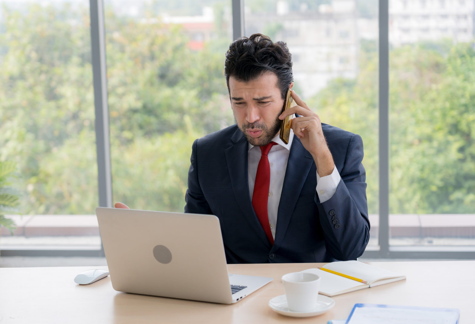 stressed man is on the call to discuss about clip index update