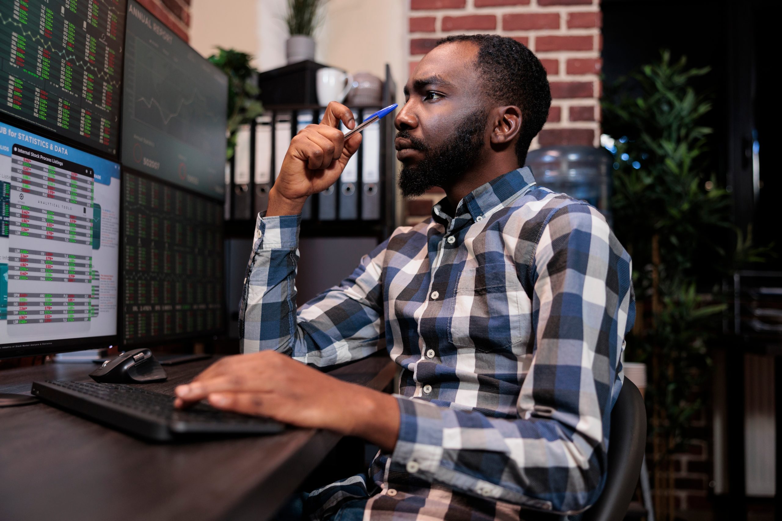 broker concentrating and analyzing stock trading