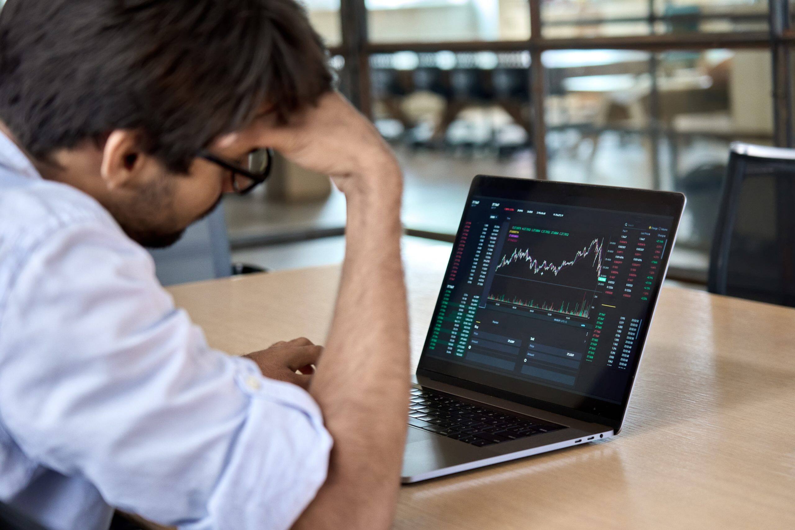 stressed trader analyzing the stock exchange