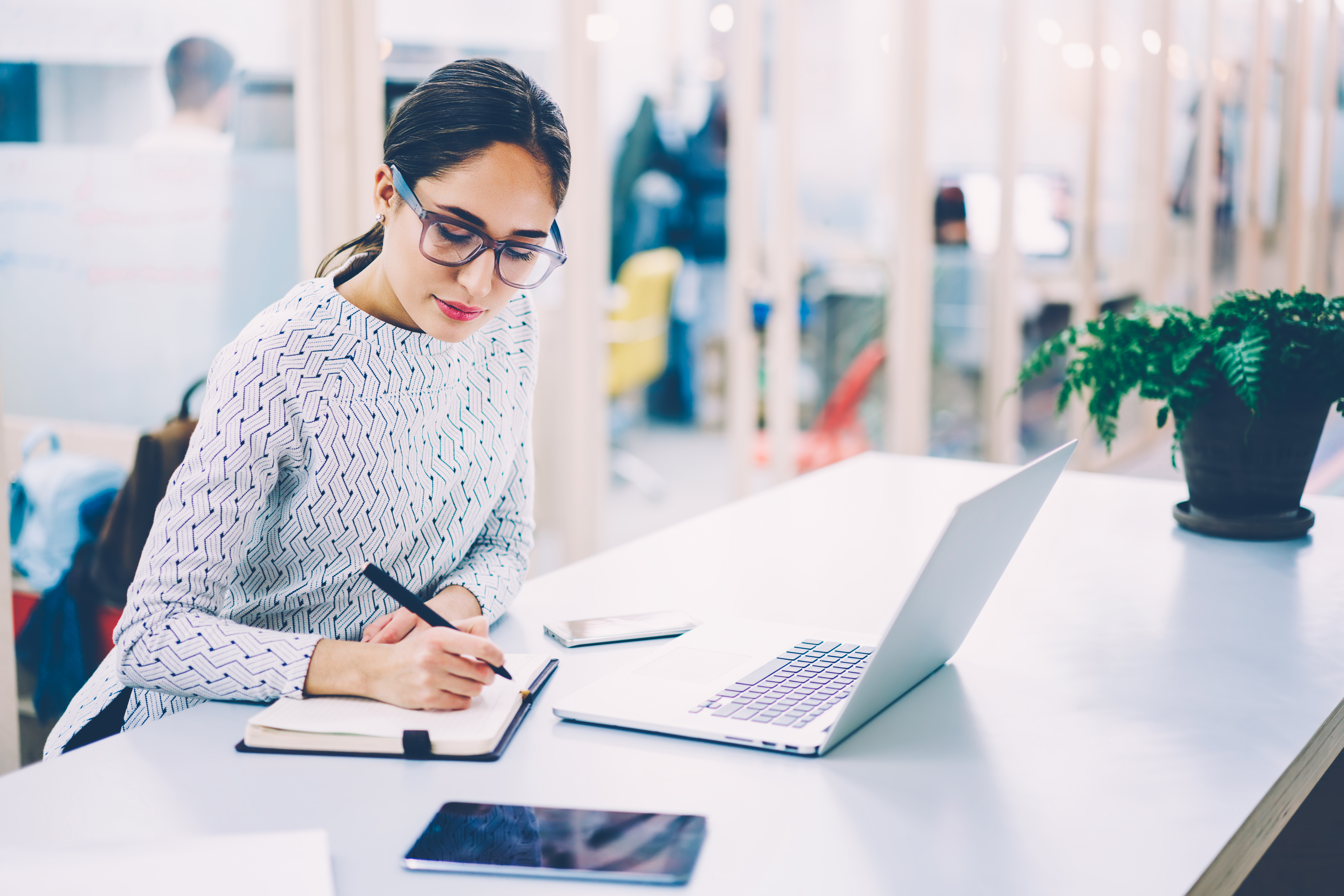 woman in eyewear preparing finances