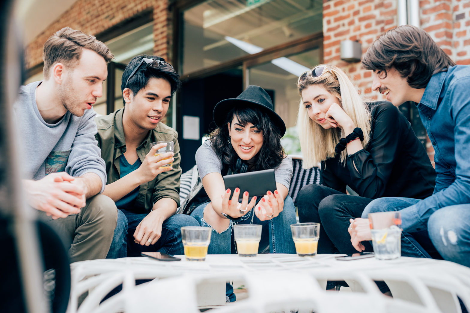 group of young multiethnic friends sitting