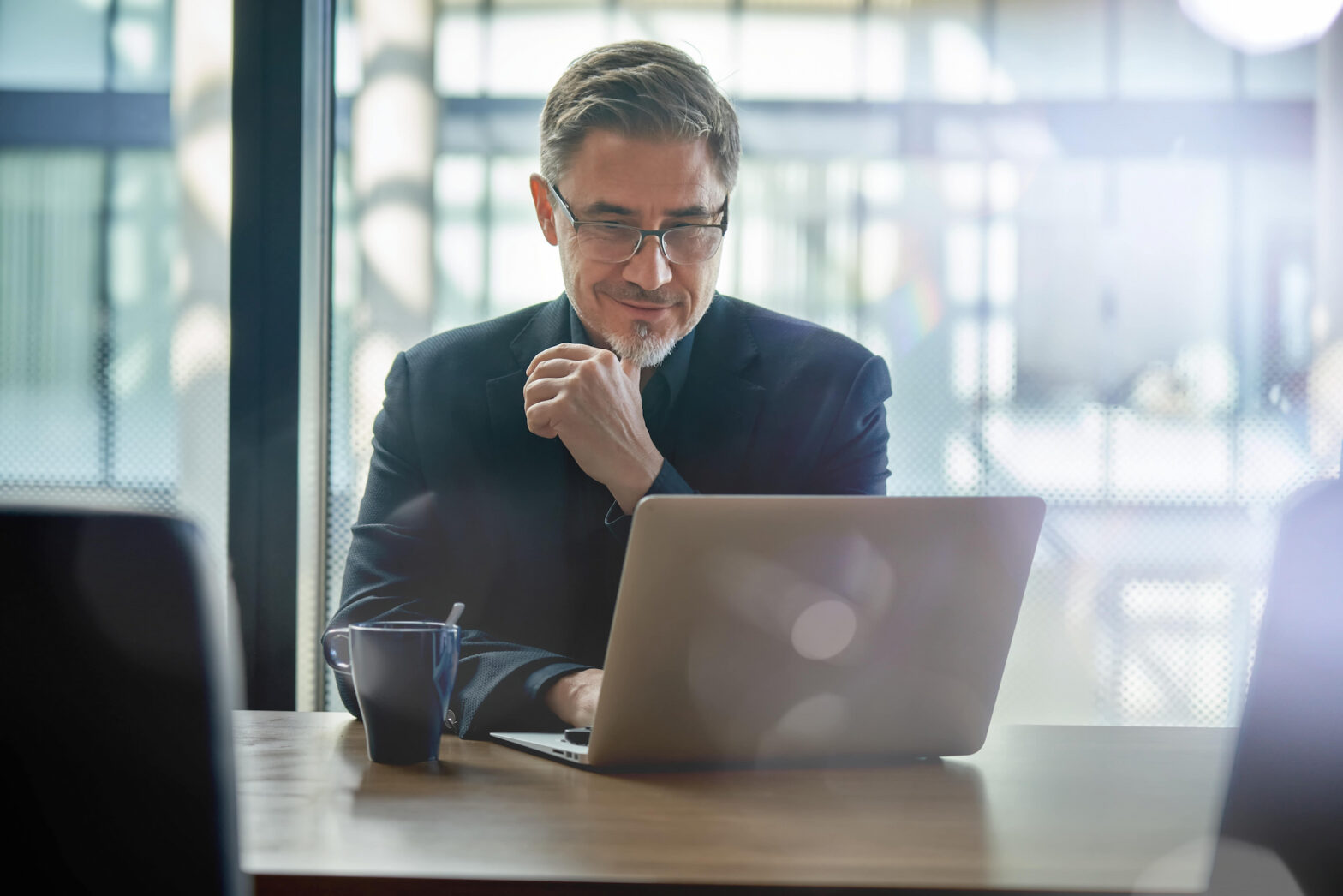 investor looking at his laptop to check stocks