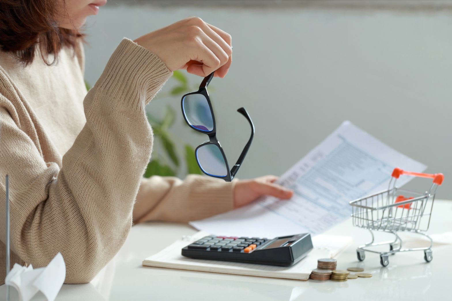 unhappy women reading bank statement