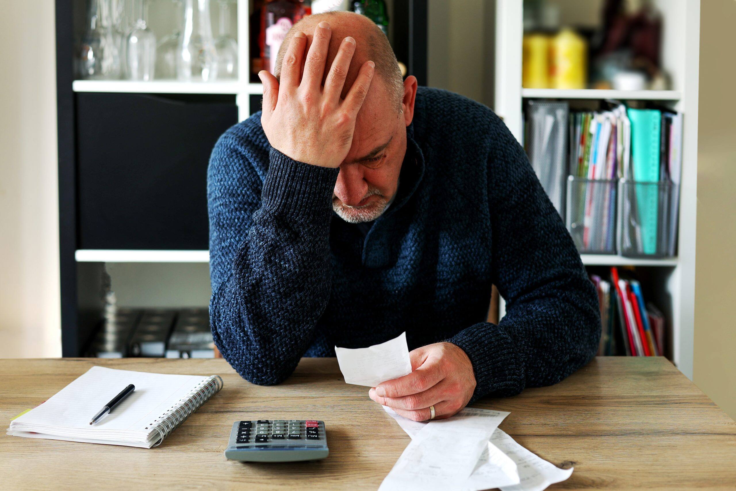 man upset headache depressed from family cost