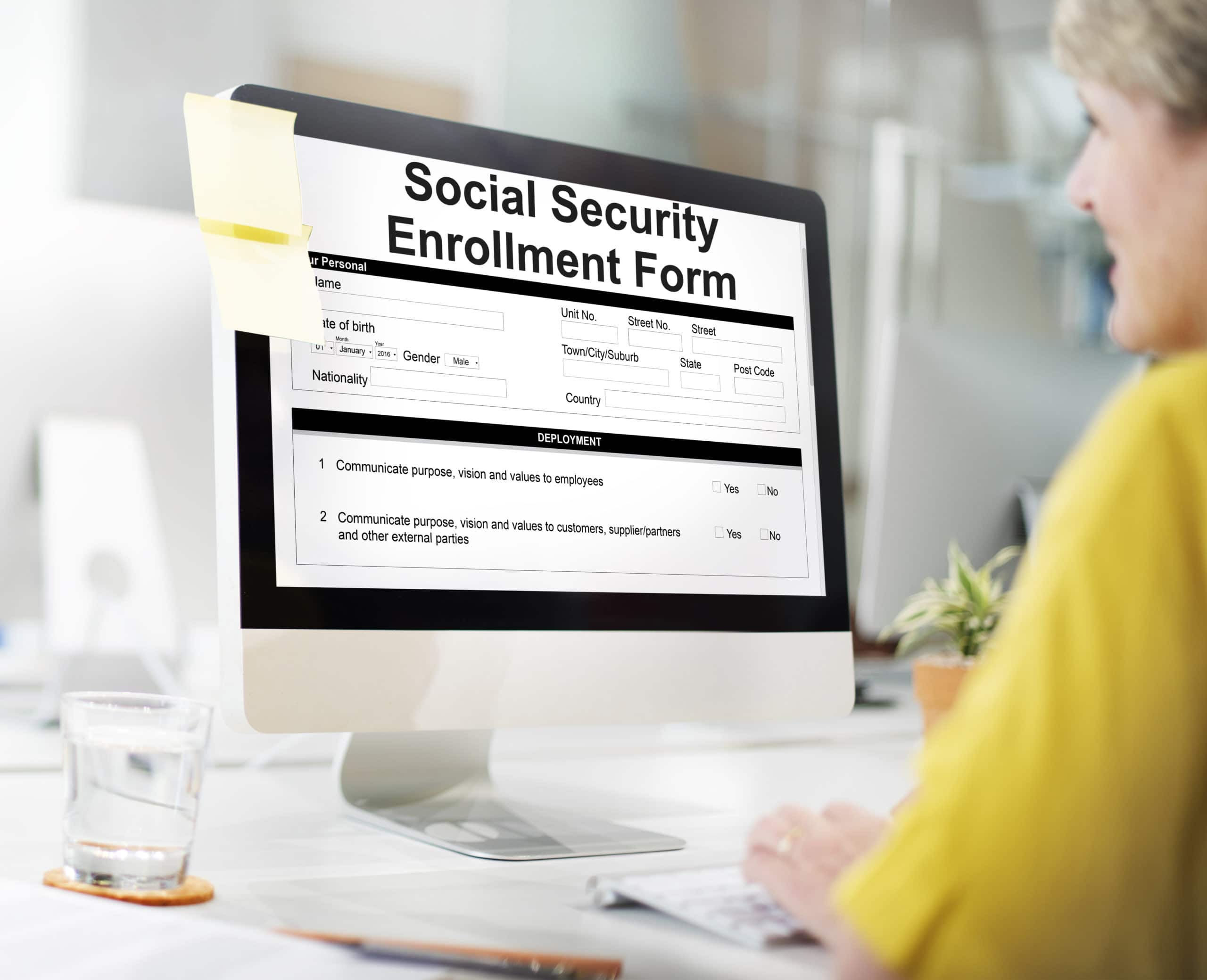 women checking social security enrollment form