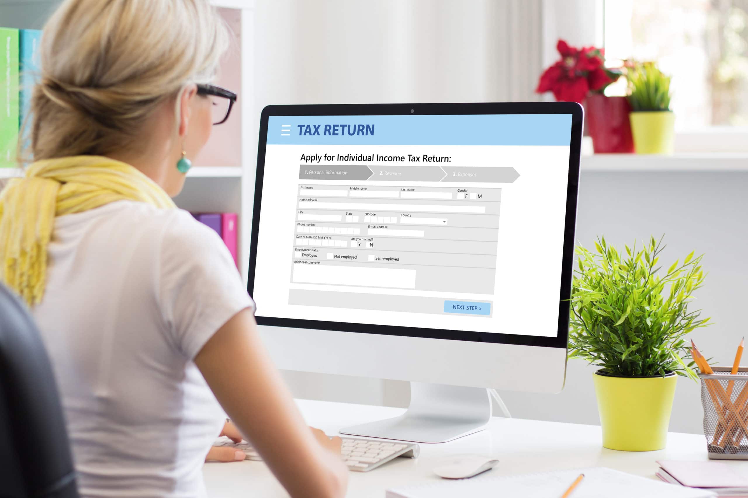 woman submitting individual income tax return form