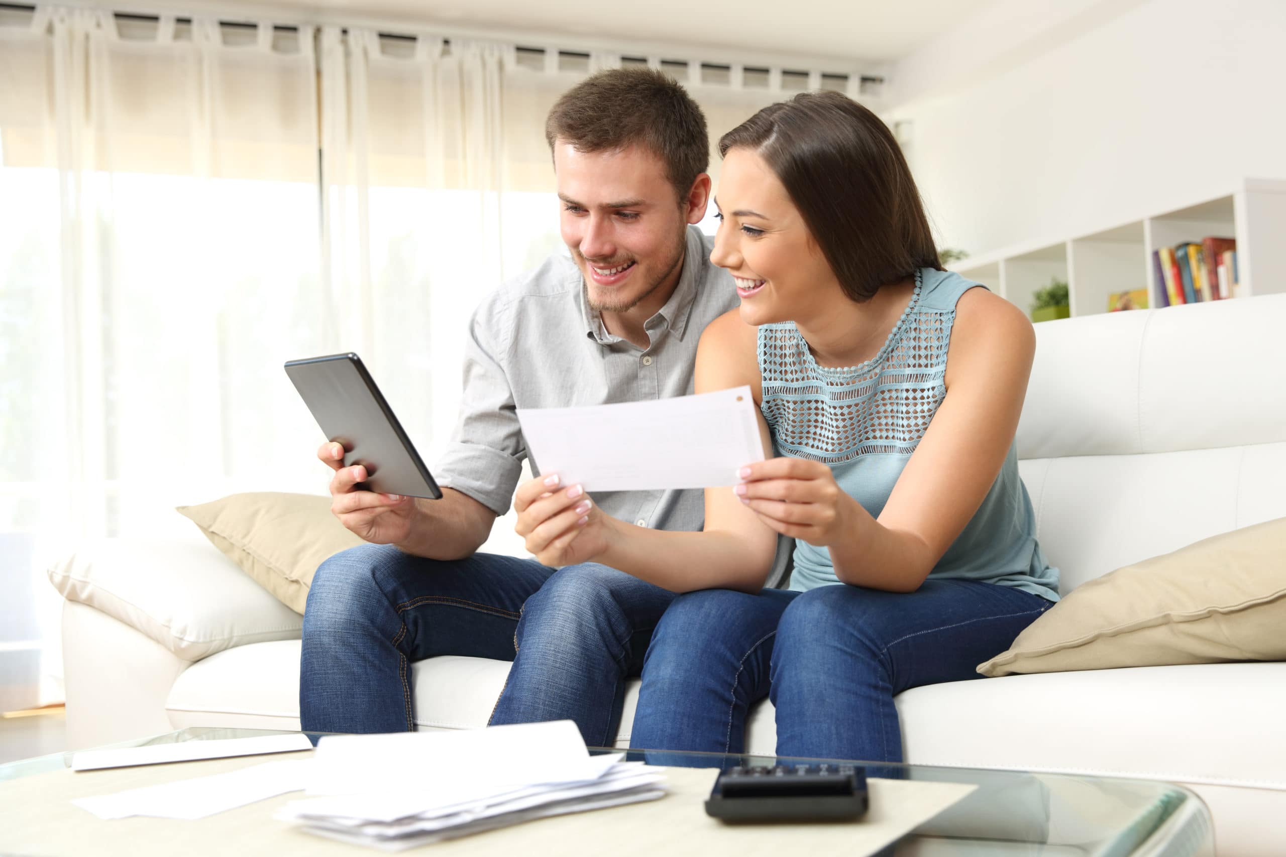 couple checking bank account on tablet