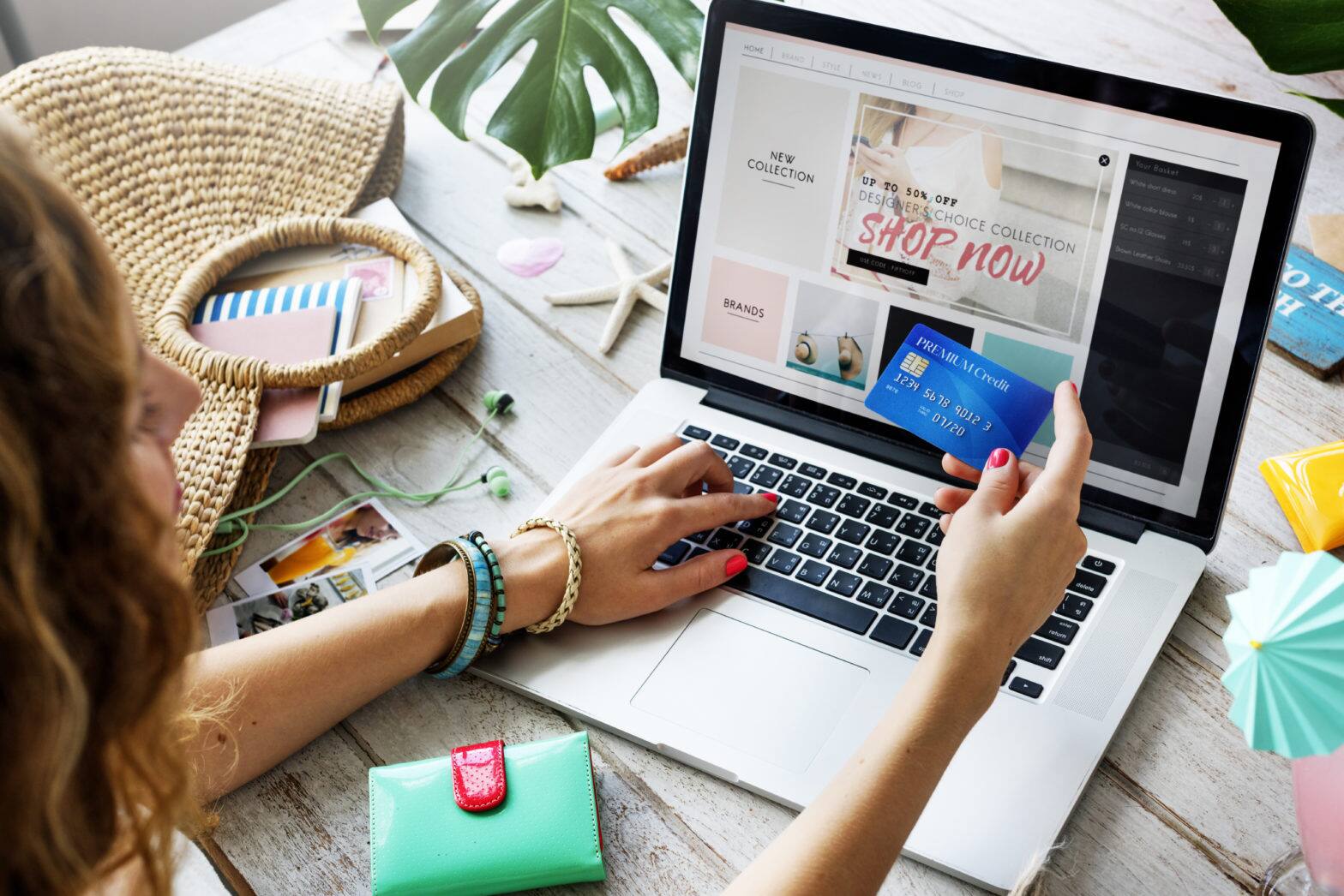 women shopping online on laptop using credit card