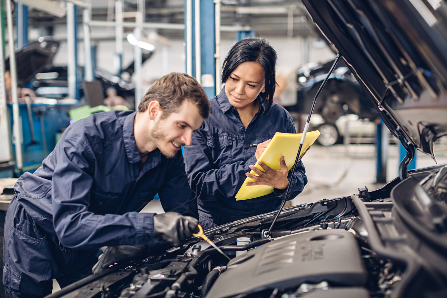 auto car repair service center two mechanics working