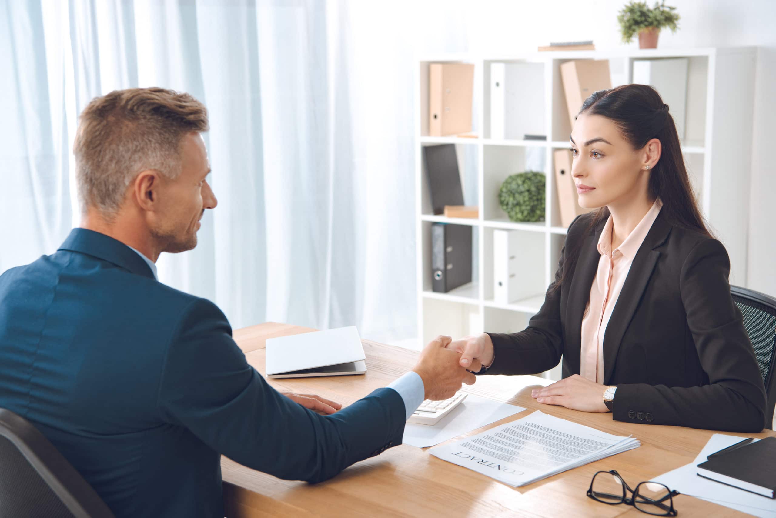 man shaking hands with personal loan agent