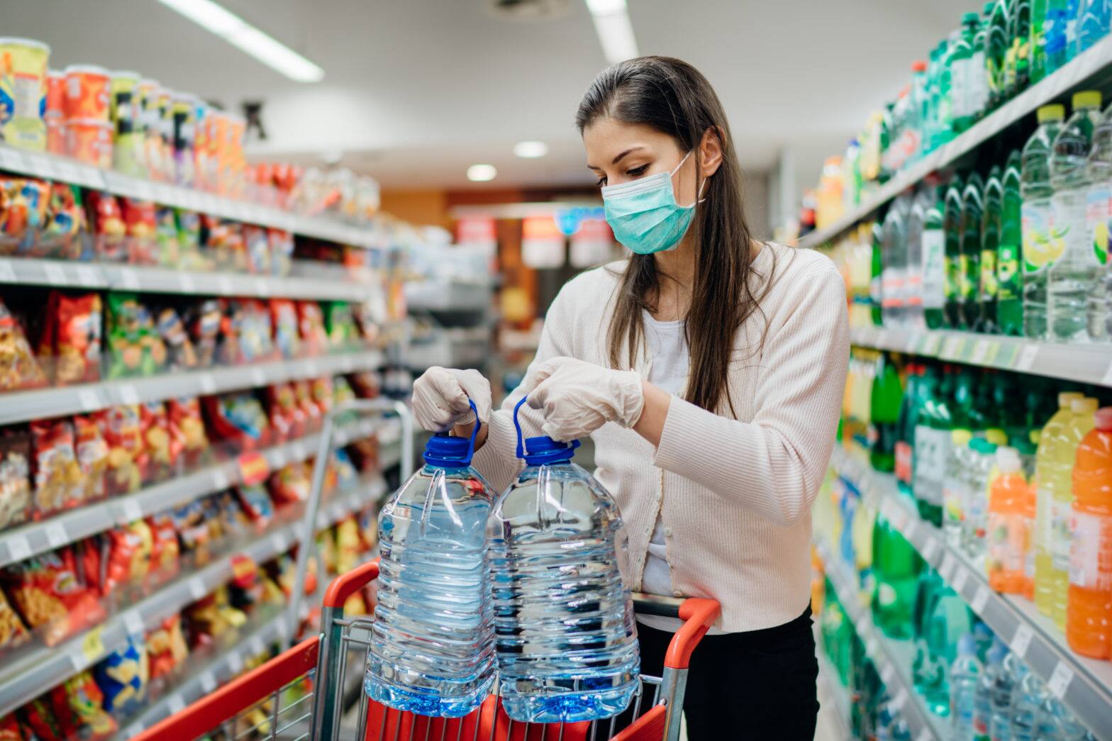 buyer wearing a protective mask during the pandemic emergency to buy
