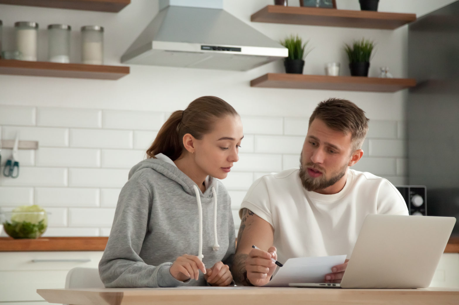 couple analyzing personal loan mistakes to avoid