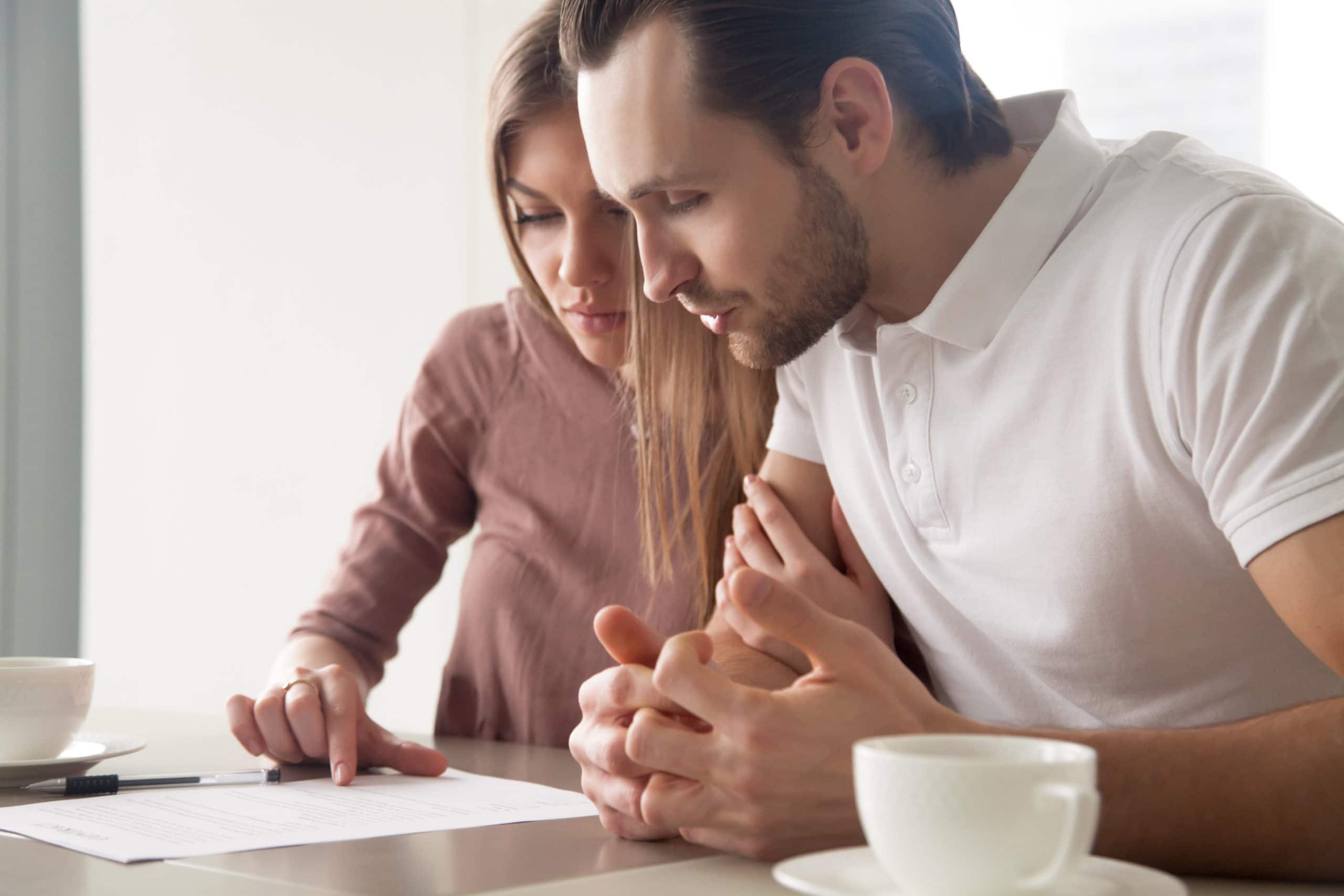 couple reading and comparing personal loan offers