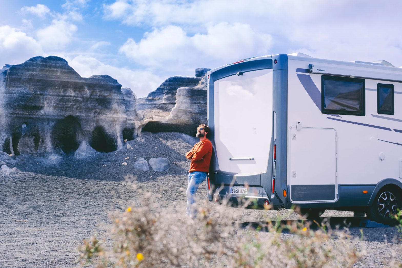 man standing next to his rv