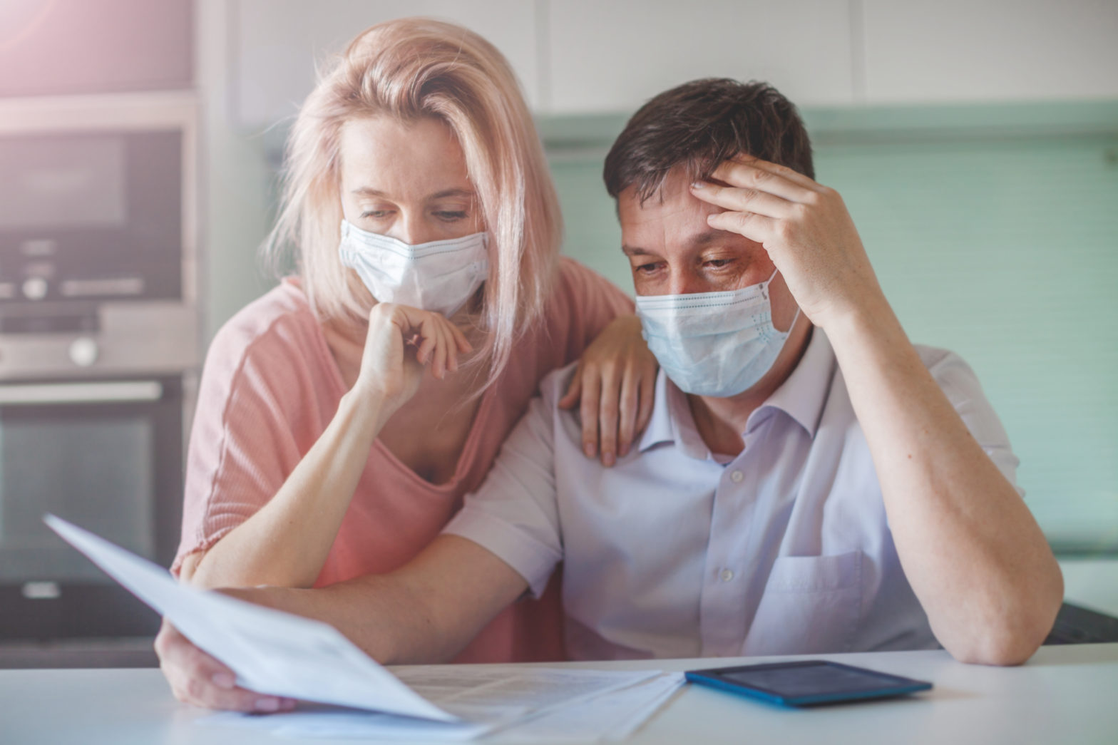 couple worried about paperwork discuss cashing out a 401K