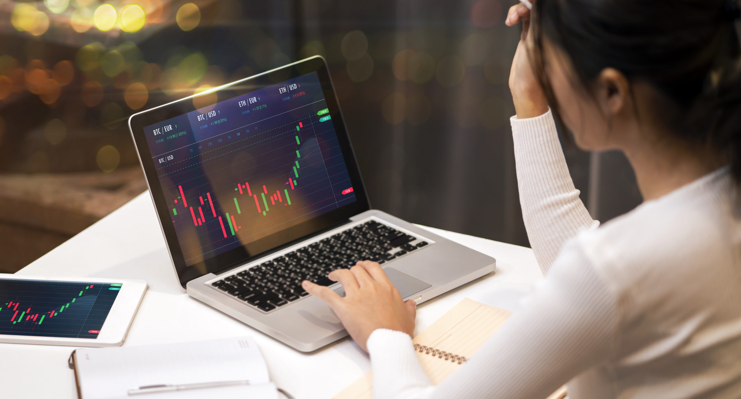 businesswoman trader work from home using laptop and tablet