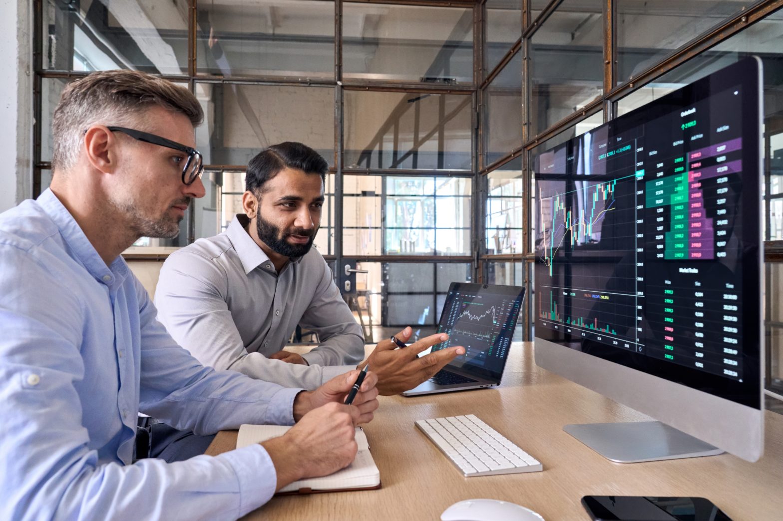 two investors discussing stock market strategies