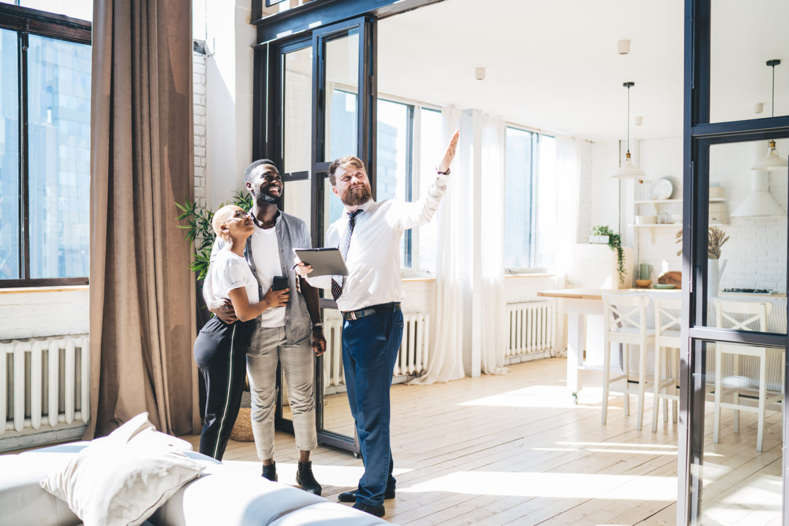 a couple standing in the new flat and looking around