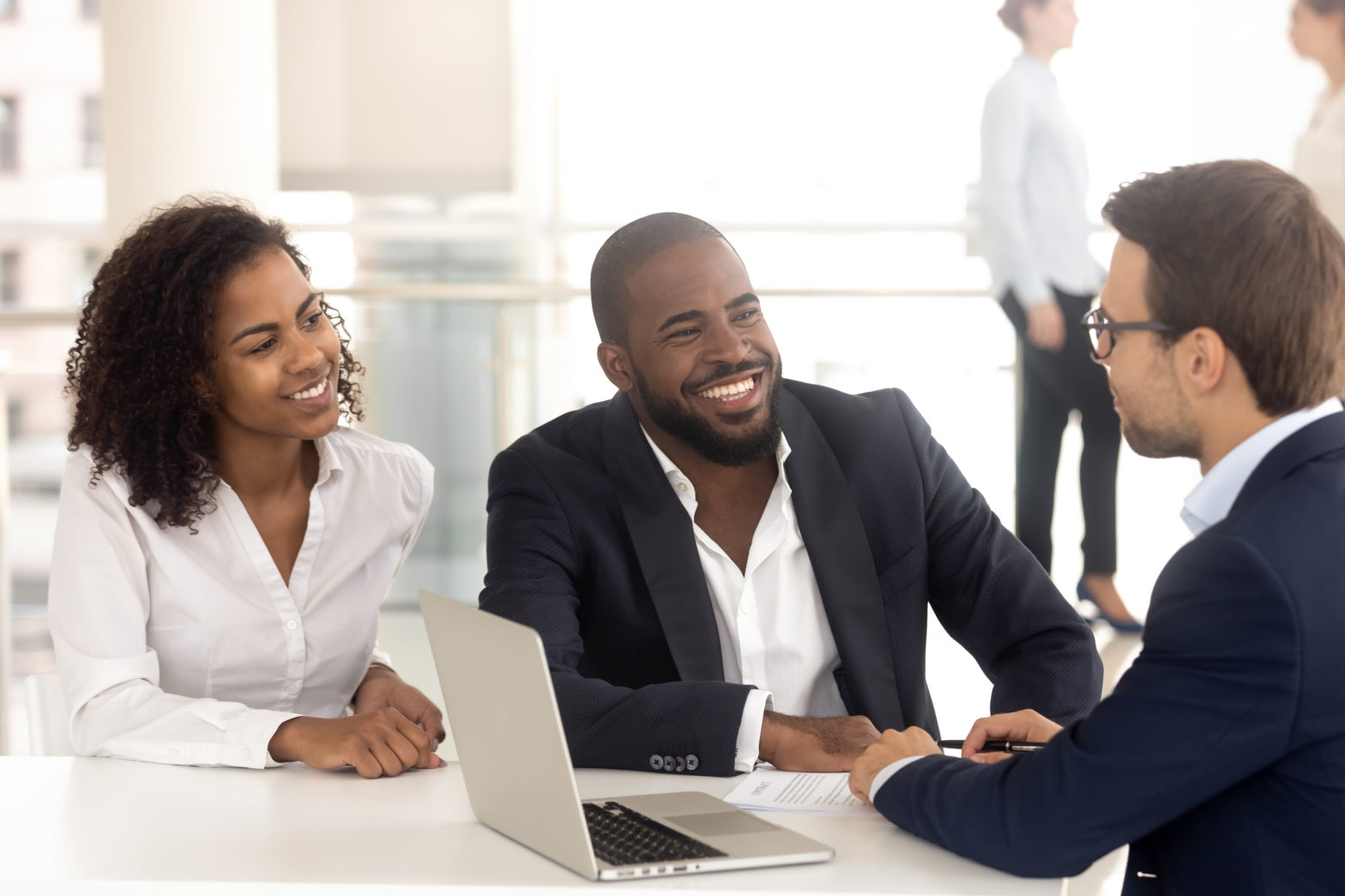 Couple consulting with a male agent to know about FDIC coverage limits