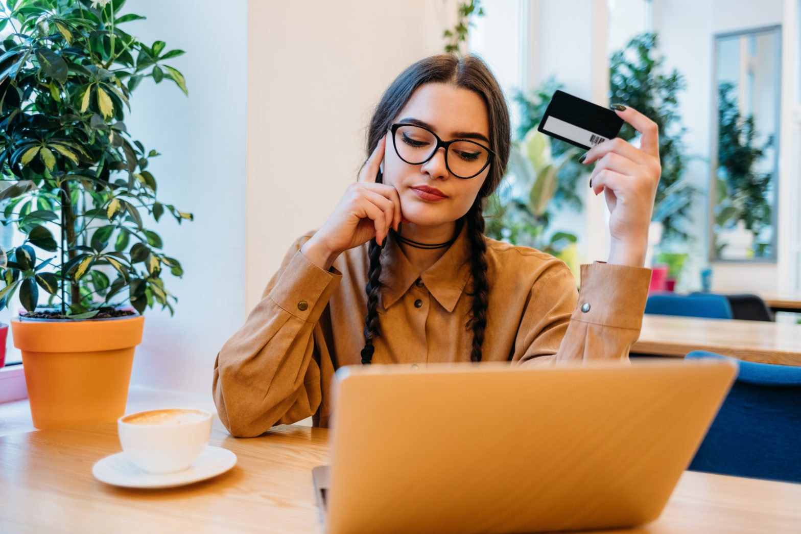 woman with laptop and secured credit card