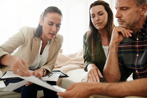 A couple discusses retirement strategies with their financial advisor
